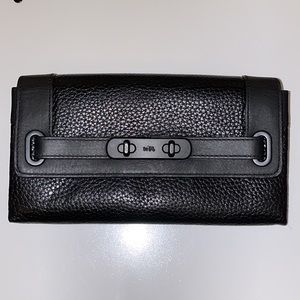 Coach Swagger wallet; black pebbled & smooth leather; used, very good condition